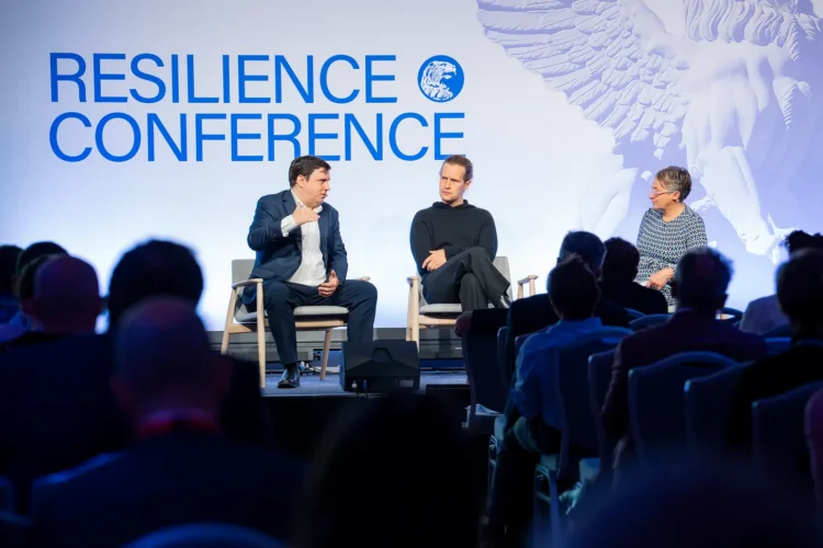 Steven Barrett, Cambridge Aeorspace and Charlie March, Never Lift on stage at Resilience Conference with Resilience Media Managing Editor, Ingrid Lunden