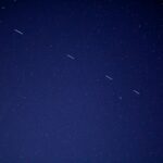 birds flying in the sky during night time