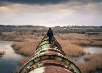 person on top of brown steel frame