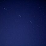 birds flying in the sky during night time