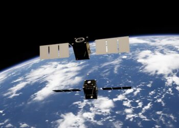 a satellite satellite flying over the earth