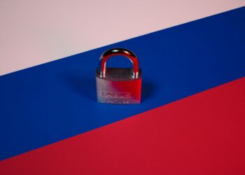 a padlock on a red, blue, and pink background