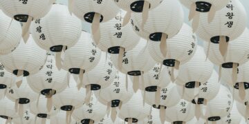 white-and-black paper lanterns during daytime