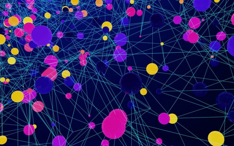 a large group of colorful balls floating in the air