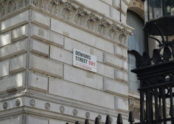 a street sign on the side of a building
