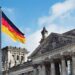 The German flag flying above the Reichstag building in Berlin, Germany