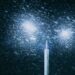a street light in the snow at night