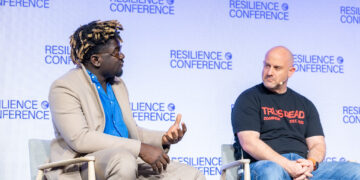 Terra CEO Nathan Nwachuku with Dominion Dynamics CEO Eliot Pence on stage at Resilience Conference