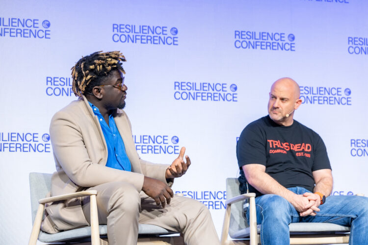 Terra CEO Nathan Nwachuku with Dominion Dynamics CEO Eliot Pence on stage at Resilience Conference