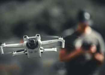 A person controlling a drone.